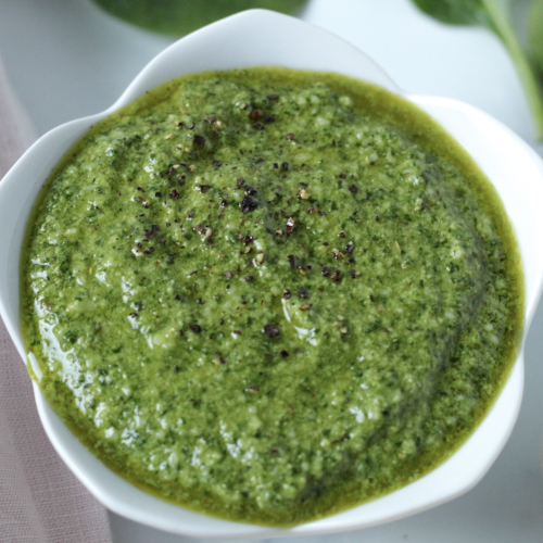 Pesto made with basil in a white bowl