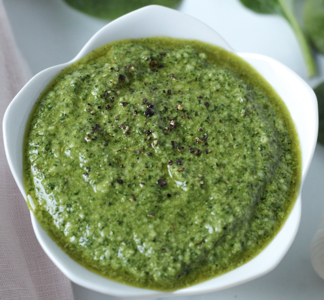 Pesto made with basil in a white bowl