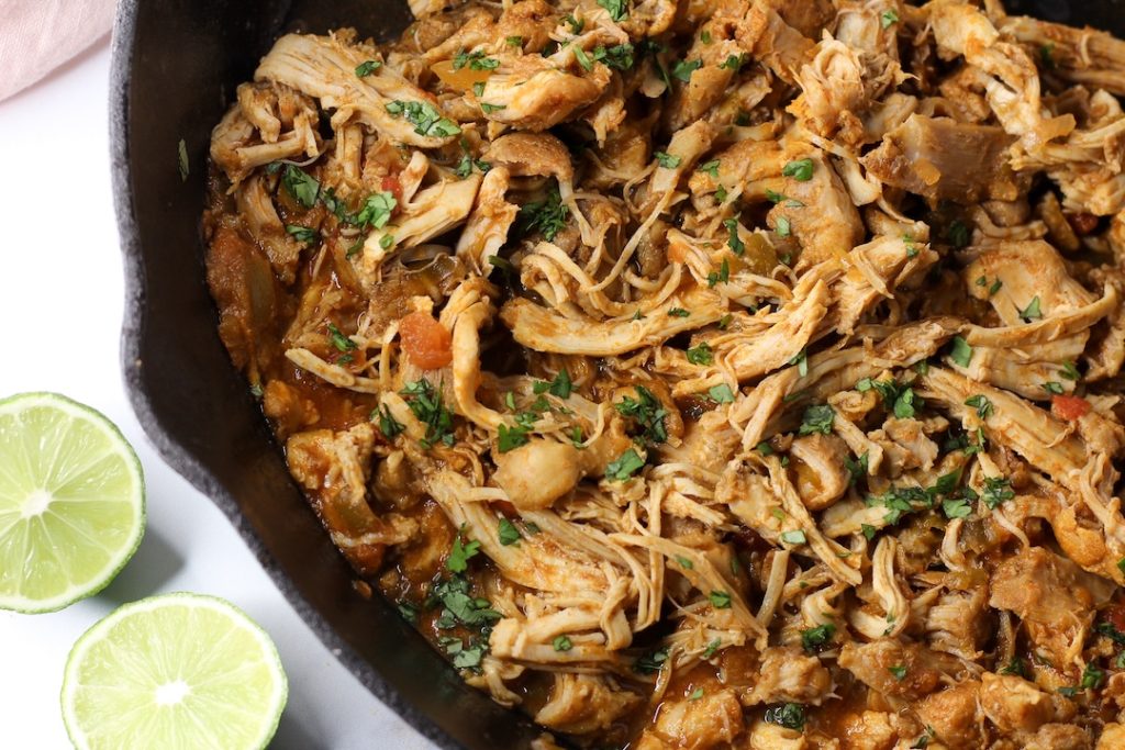 mexican shredded chicken in a cast iron pan