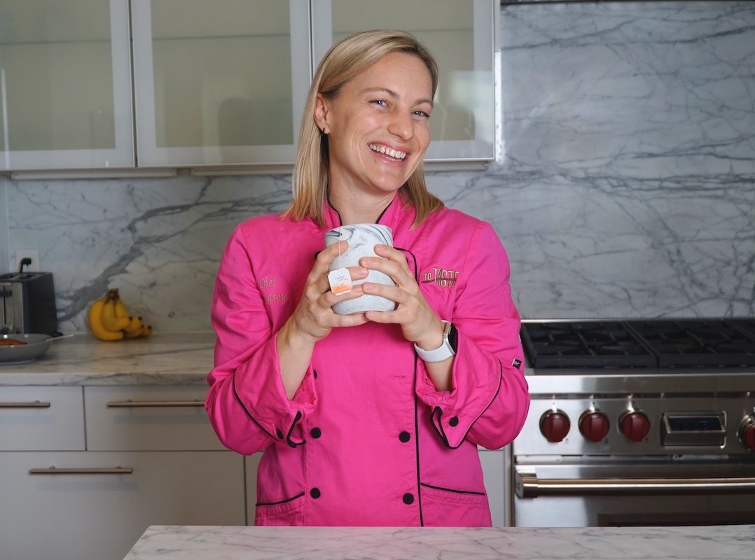 Chef Lindsey Schoenfeld, RDN in a pink chef's coat