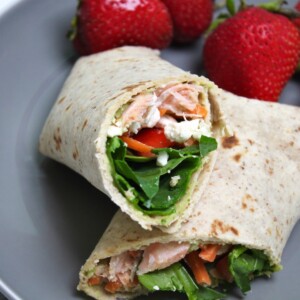 healthy wrap base recipe on a gray plate with strawberries in the background