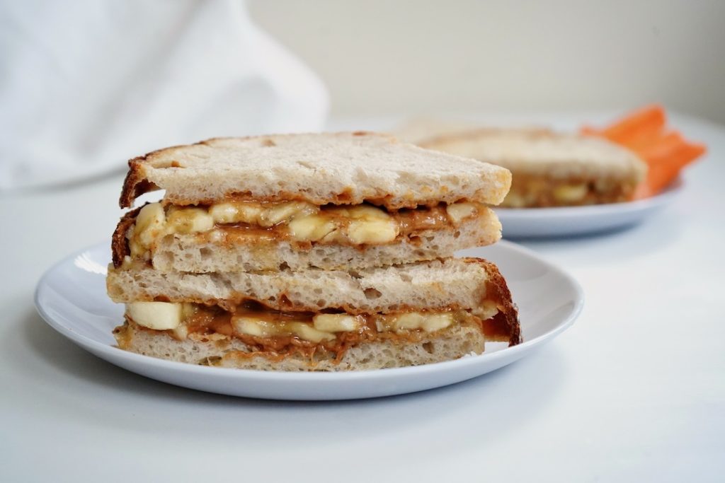peanut butter banana sandwich stacked on a plate