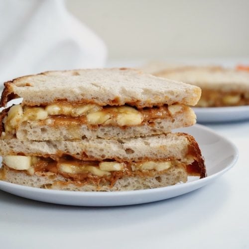 peanut butter banana sandwich stacked on a plate