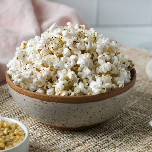 Parmesan popcorn with Italian seasoning in a bowl.