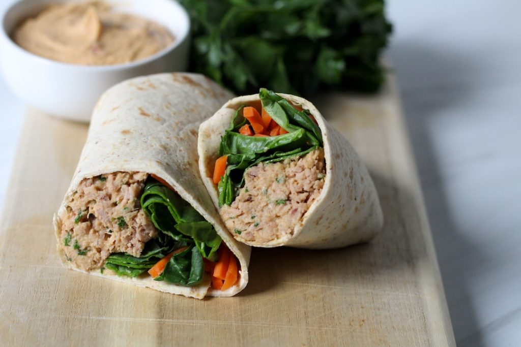 Hummus tuna wrap on a cutting board