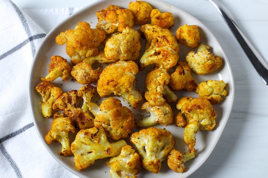 Turmeric roasted cauliflower on a white plate