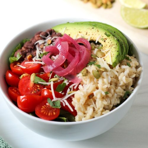 Vegetarian Burrito Bowl made with black beans, brown rice, avocado, pico de gallo, and pickled onions